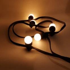 ILLUPRO - Guirlande 50 mètres guinguette ip65 50 ampoules g45 led plastique 1w blanc chaud 2700k câble noir prolongeable
