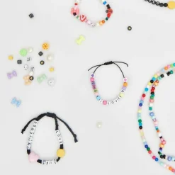 RICO DESIGN - 165 perles centre coeur 5 x 7 mm - noir et or